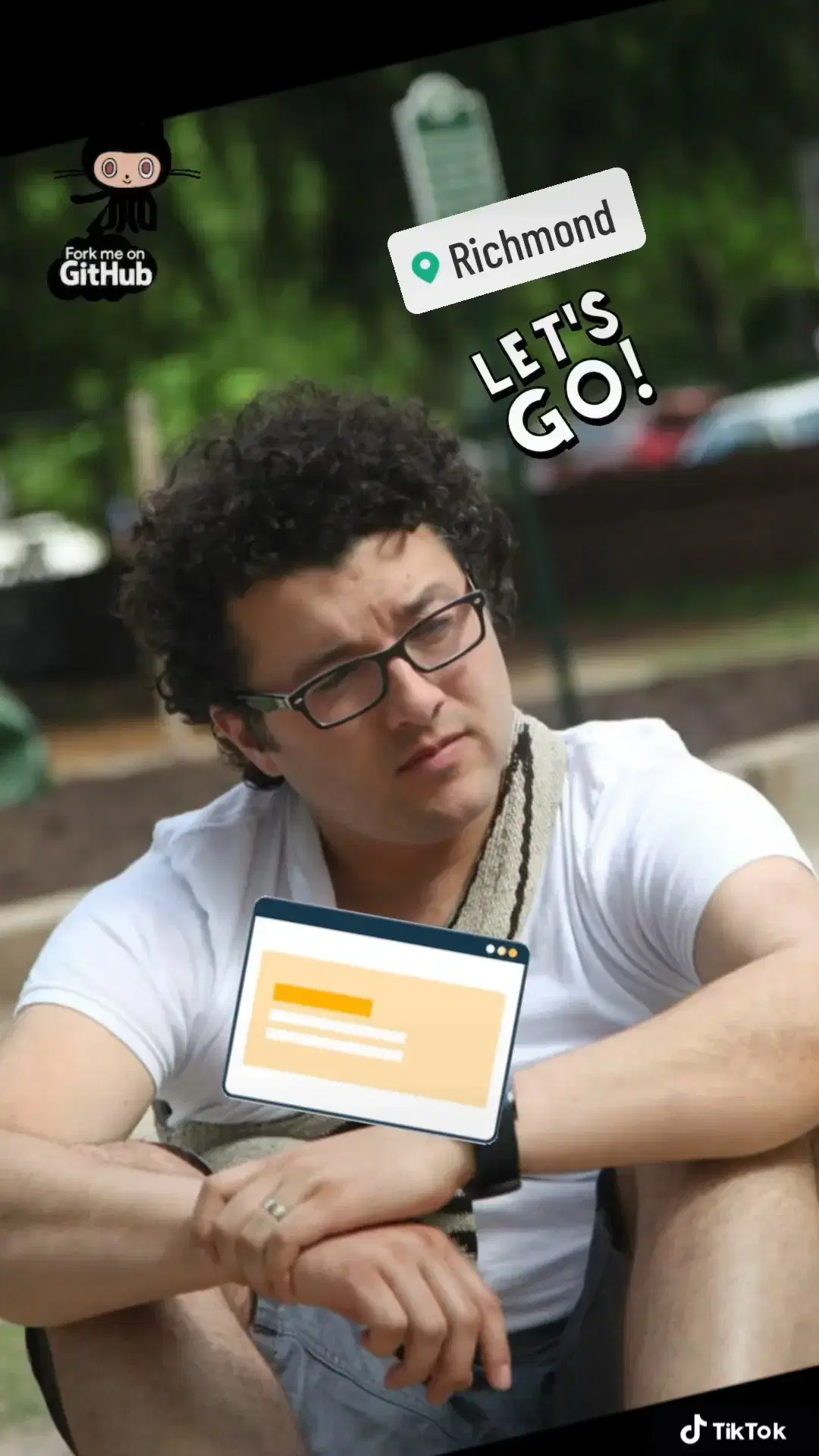 Andrei Olea at a park wearing a white t-shirt and carrying a mochila